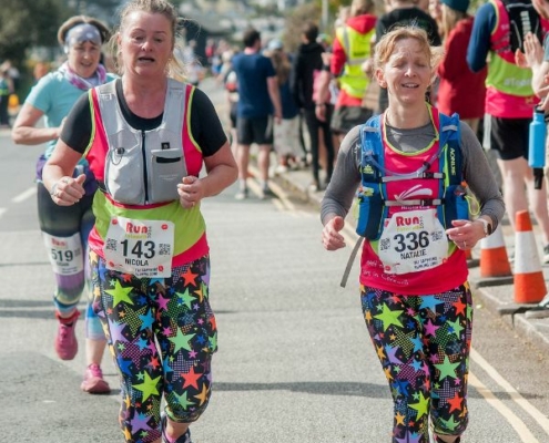 Run Falmouth 2024 two female finishers in hospice vests