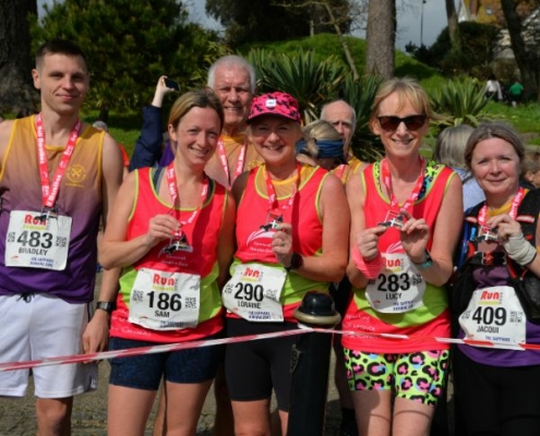 CHC Finishers with medals Run Falmouth Half Marathon