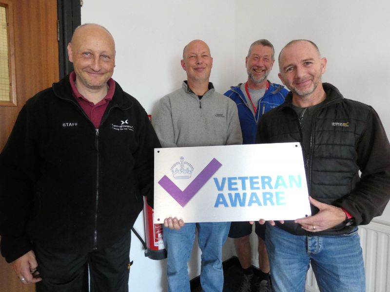 Veterans who work for Cornwall Hospice Care launch Veteran Aware status at the charity's Daniel's Lane warehouse and offices site in Holmbush, St Austell