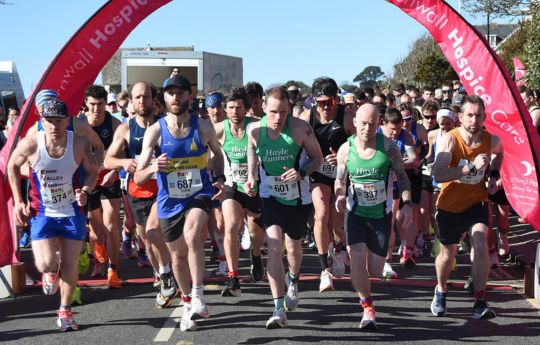 The start of Run Falmouth 2025 with course record breaker at the front